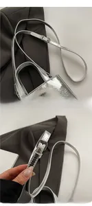 Detail of silver oil-wax leather small square bag with adjustable thin shoulder strap