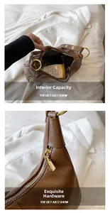Détail de la capacité intérieure et ferrures dorées du sac porté épaule en cuir brun