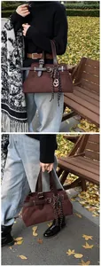 Detail of dark brown frosted tote bag with silver metal buckle and decorative knot charm
