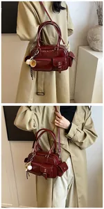 Close-up of burgundy glossy bowling bag with multiple functional pockets and accessories