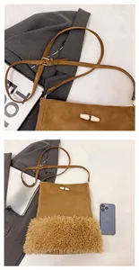 Detail of adjustable leather strap and suede bucket bag with faux fur trim and toggle