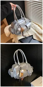 Close-up of silver PU bowling bag with multi-pockets and baseball themed charms