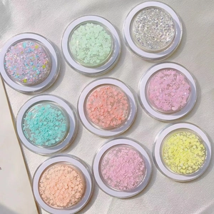 Detail view of 9-piece glitter and sequin set in round transparent storage containers