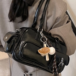 Glossy black PU bowling bag with vintage silhouette and stylish baseball bag charms