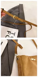 Detailed close-up of adjustable strap and golden toggle clasp on brown suede bucket bag