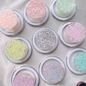 Flat lay view of multiple glitter Magsafe phone grips in various sparkling colors and patterns