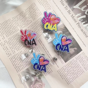 Set of four CNA retractable acrylic badge reels with rainbow heart and 360 rotation clip