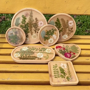 Handmade wood resin coasters with real dried flowers including daisy and heart shapes