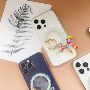 Detail view of MagSafe phone case with magnetic ring stand and colorful beaded charm strap