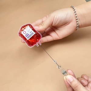 Retractable acrylic blood bag badge reel with red glitter and medical label for nurses