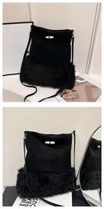 Detail of black bucket bag featuring faux fur patchwork and a decorative horn button