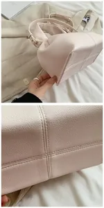 Makro-Detail der Cloud-Tasche mit Kieselleder-Textur und genähtem Taschenboden