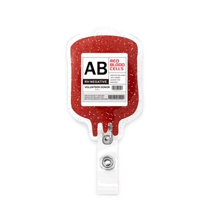 Detail of retractable blood bag badge reel with red glitter acrylic and metal snap