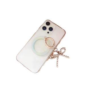 White MagSafe phone case with iridescent magnetic ring and pearl bow charm accessory