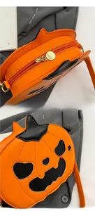 Macro detail of pumpkin crossbody bag showing zipper closure and textured orange PU leather