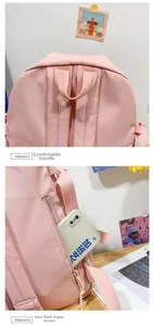 Pink backpack detail showing padded top handle and hidden anti-theft back zipper pocket