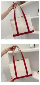 Close-up of contrast canvas tote bag featuring beige body and dark red handle details