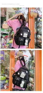 Close-up of black nylon backpack with multi-pockets and cute cartoon charms for students