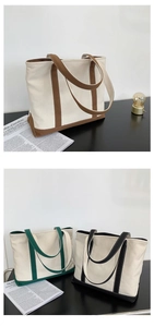 Detail of color-block canvas tote bag with reinforced handles in various colors