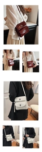 Detail of vintage double-pocket shoulder bag with shiny faux leather and metal twist locks