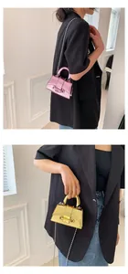 Micro metallic crossbody bag with chain strap in pink and gold mirror finish