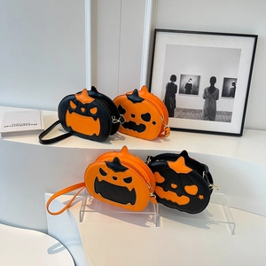 Quirky pumpkin shaped crossbody bag with orange and black Halloween design and gold zipper
