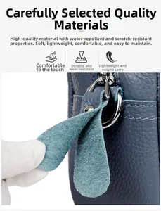 Macro shot of blue leather texture with reinforced zipper puller and metal hardware details
