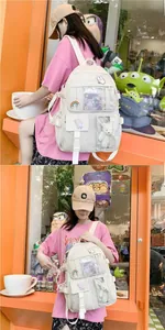 Detail of off-white school backpack featuring cute patches and a clear PVC pocket with plush