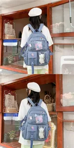 Blue canvas school backpack with transparent pocket and plush charms for students