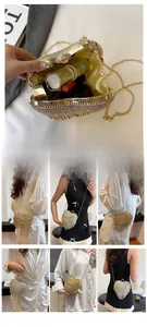 Macro detail of heart-shaped rhinestone evening bag with elegant fringe and chain