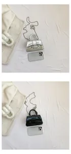 Mini metallic top handle bags in silver and black with ball chain and metal clasp detail
