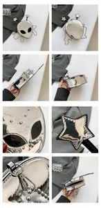 Detail view of silver metallic alien crossbody bag with bead chain and star accents