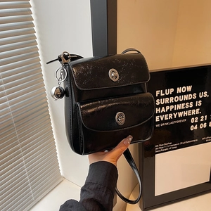 Retro black crossbody bag with double flap silver twist locks and glossy finish