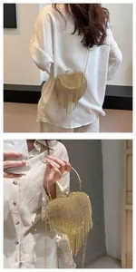 Detail of heart-shaped gold evening bag with rhinestones and long fringe tassels
