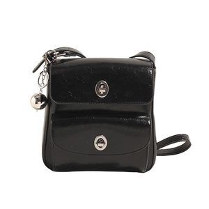 Glossy black messenger bag with double pockets and silver metallic buckle closures