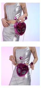 Detailed view of magenta metallic alien crossbody bag with Y2K rivets and chain