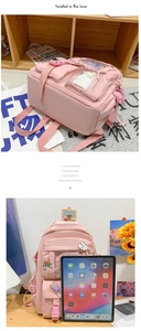 Detail of pink high-capacity student backpack with multi-pocket system and iPad storage