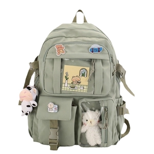 Green school backpack for students featuring multi-pocket design and cute bear ornaments