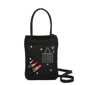 Fashionable black crossbody bag with red lipstick charm and sparkling crystal details