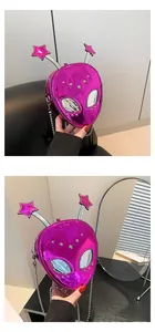 Detail of purple metallic alien crossbody bag with star antennae and silver chain strap