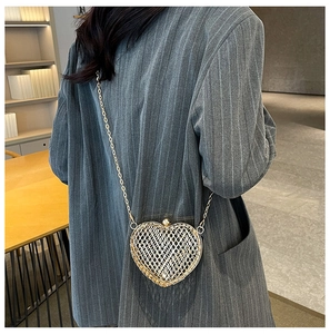 Exquisite gold heart-shaped metal mesh evening bag with a fine chain strap detail
