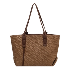Brown woven leather tote bag with elegant handles for daily commute and autumn style