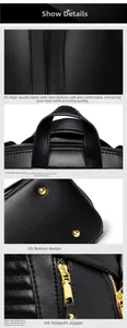 Detail of black pebbled leather texture, reinforced handle, and gold metal hardware zippers
