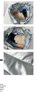 Détail de l'intérieur du sac de voyage argenté imperméable à grande capacité et brillant
