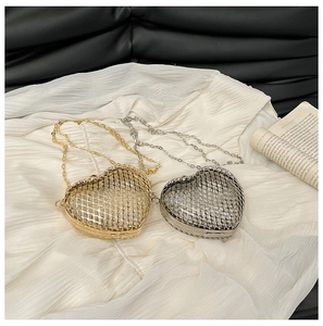 Exquisite gold and silver heart-shaped metal hollow clutch bags with chain straps