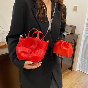 French petal flower bucket bag in bright red leather with silver chain strap