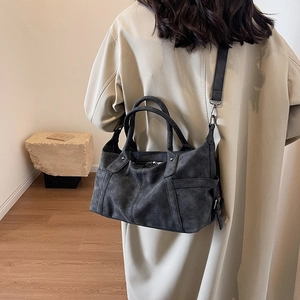 Retro charcoal grey frosted Boston handbag shown from a stylish side perspective