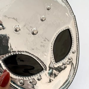 Alien-shaped silver mirror crossbody bag with cyberpunk metal rivets and black eyes