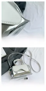Close-up of metallic silver handbag with white flap and smartphone size comparison