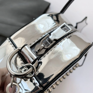 Metallic silver alien messenger bag with punk rivets and high-gloss chrome finish